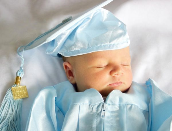 Little baby girl in graduation cap and gown Stock Photo | Adobe Stock